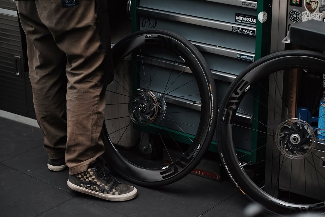 Premium ENVE SES carbon wheelsets undergoing technical inspection and bearing service at Monkeycycle